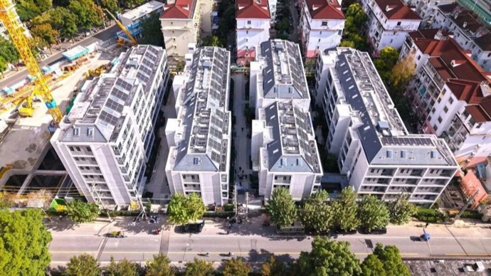 总书记在沪考察的市民新村居民区，是如何实现原地改造“焕新”的